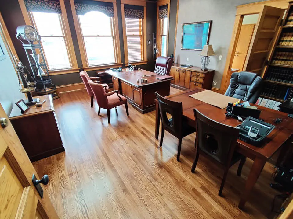 Red oak hardwood floor with warm grain tones.