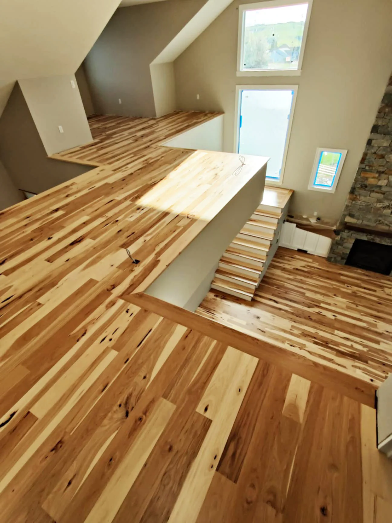 Neutral character grade plan hickory flooring with neutral sealer.